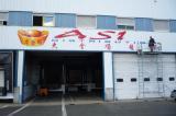 enseigne entrepot 16m x 1;90m en cours de pose